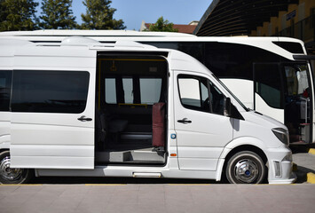 shuttle minibus with open door on bus station