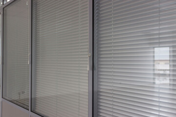 Glass office partitions with shutters
