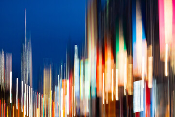 New York City night scene at Chelsea Pier with abstract blurred light streaks from the skyline buildings