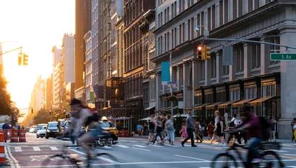  Crowded street scene with people, cars and bikes at the busy intersection of 23rd St and 5th Avenue in Manhattan New York City © deberarr