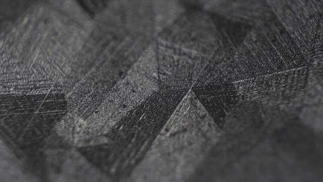 Galvanized metal surface with zinc for corrosion protection. Crystallized surface of galvanized iron sheet. Microstructure of zinc coating for the automotive industry. Multiple magnification 