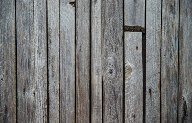 Brown or gray wood texture. Abstract background, blank template.Background of old wooden boards with holes and nails.