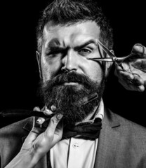 Vintage barber shop, shaving. Portrait bearded man. Vintage barbershop. Bearded client visiting barber shop. Barber scissors and straight razor, barber shop, suit. Black and white