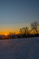 Sunrise near Ctibor and Halze villages in cold snowy morning