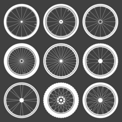 White bicycle wheel symbols collection. Bike rubber tyre silhouettes. Fitness cycle, road and mountain bike. Vector illustration.