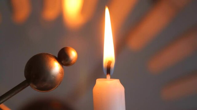 The effect of an electric field on a candle flame.
The candle flame changes its shape and orientation under the influence of an electric field.
