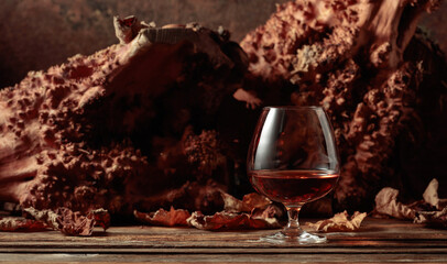 Sniffer of brandy on an old wooden table.