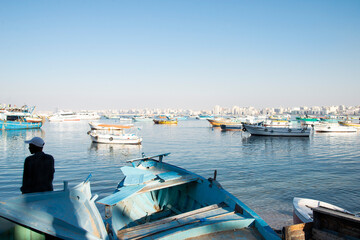 View of boats from the Corniche of Alexandria in evening light on the Mediterranean Sea, Alexandria, Egypt