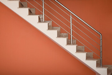 Modern aluminum stairs going upwards in new house interior