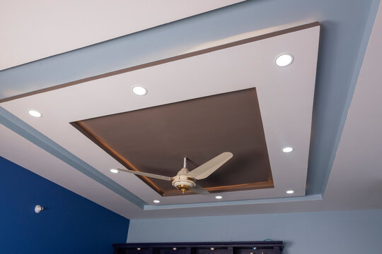 Brown color roof celling and luxury fan interior idea