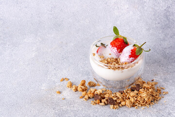 yogurt with granola and strawberries, copy space