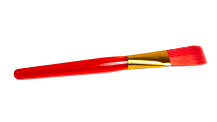 Red plastic brush for paint isolated on the white background