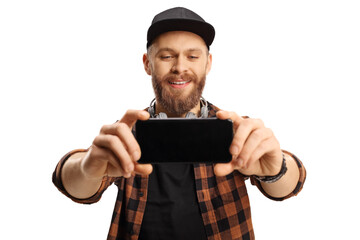 Bearded trendy guy taking a selfie photo with a smartphone