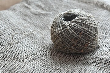 a ball of harsh threads on a gray canvas. concept. search for an exit. ariadne's thread