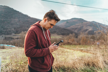 A man operating a drone controller