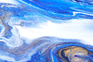 Photograph of abstract blue floating paints texture for background