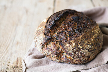 Homemade rye sourdough bread with black sesame. Healthy eating concept.