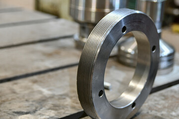 Support nut with external threads and side holes.