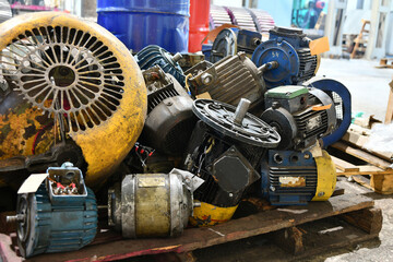 Warehouse for old broken and unused AC and AC motors in an electrical workshop.