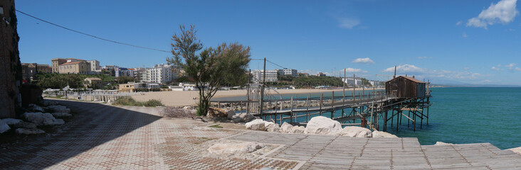 walkway of Trabucco, the ancient fishing machine in the sea, along the city walls the Swabian...