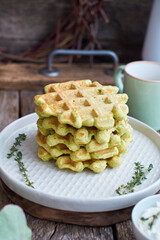 Belgian avacado waffles. Side view, wooden background. Rustic. 