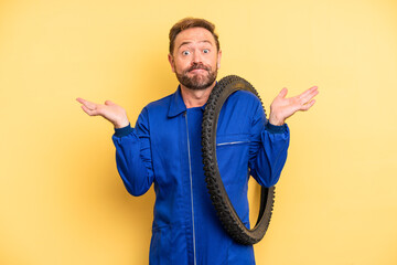 middle age man feeling puzzled and confused and doubting. bicycle mechanic concept