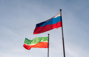 Flag of Russia and flag of the Republic of Tatarstan against the sky. Waving flags