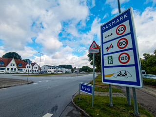 Danish Border street sign in Krusa Danmark saying Danmark (Denmark) on the Danish and German border road - 478387529