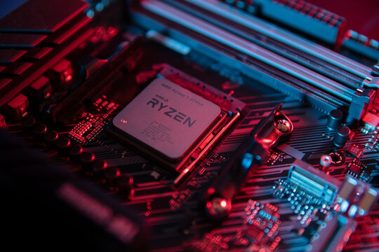 WROCLAW, POLAND - November, 2021: AMD Ryzen 7 3700x Processor close up in the black motherboard CPU socket. Advanced Micro Devices is an American semiconductor company based in Santa Clara, California