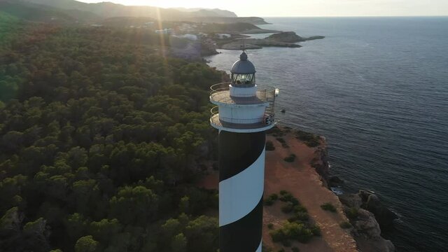 Aerial video of the Moscarter lighthouse, in Portinatx, a town in the north of the island of Ibiza.
