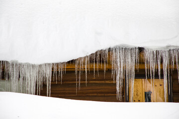 Icicles Hanging Over Winter Cabin