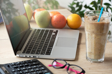 Work desk with laptop and healthy food of modern blogger, manager. Healthy lifestyle concept