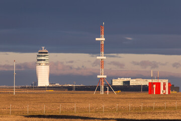 Airport infrastructure with tower, runway, antennas and terminal