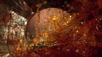 Super Slow Motion Shot of Splashing Whiskey in Old Oak Barrel at 1000fps. - Powered by Adobe