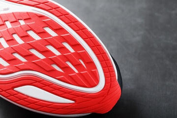 Close-up of the sole of a sport running shoe for running in red