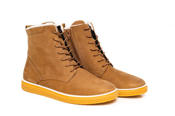 brown leather winter boots with lacing on a white background