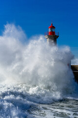 red lighthouse in the sea