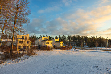 Beautiful winter  landscape view of suburban villas  on sunset. Sweden.