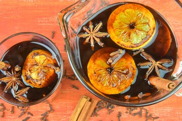 Christmas or New Year hot winter drink, spicy grog cocktail, sangria or mulled wine with tea,...