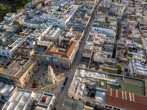 Aerial view of the Tarantini square of Ginosa in South Italy with spectacular Torre dell Orologio monument.
