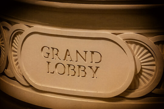 Stone Grand Lobby sign on a cruise ship, located in the atrium, atmospheric natural plaque with a vignette.