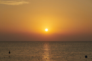 The sun rises over the Red Sea at dawn.