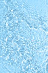 Fototapeta na wymiar Fresh water background. Bright blue pattern with natural rippled water texture and bubbles. Top view with copy space. Clear water surface background.