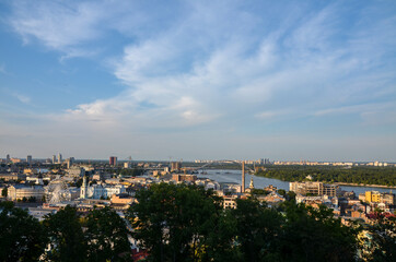Fototapeta na wymiar Panoramic view of the Dnipro River right bank and one of the oldest neighborhoods Kyiv, Podil district. Historical part of the capital of Ukraine 