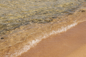 Waves on the tropical sandy beach of the red sea.