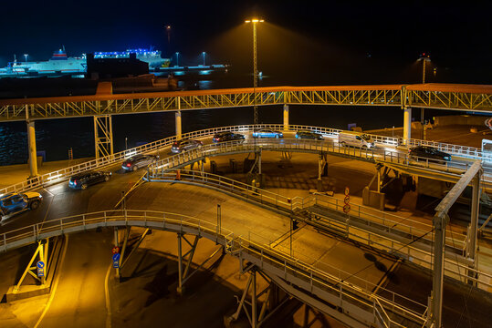 Ferry terminal and linkspan to the ro-ro ship in the harbor of Ystad at night. The ferry connects the city of Świnoujście in Poland and Ystad in Sweden