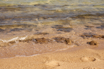 Waves on the tropical sandy beach of the red sea.