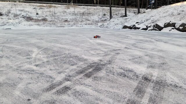 View of  radio controlled model  car on  racing track in winter. Children and adults concept.  Sweden.