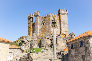 a stone pillory in front of the medieval castle of Penedono (Castelo do Magriço), Viseu district, province of Beira Alta, Portugal - obrazy, fototapety, plakaty