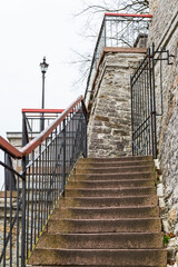 Stairs along the stone wall